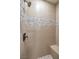 Shower with tiled walls, mosaic accents, rainfall shower head, and a built-in bench at 2571 Red Springs Dr, Las Vegas, NV 89135