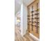 Hallway wine rack with built-in shelving for wine storage, located next to the kitchen at 2571 Red Springs Dr, Las Vegas, NV 89135