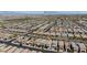 Aerial view of a residential neighborhood with well-manicured lawns and the Las Vegas strip in the distance at 2932 Tranquil Brook Ave, Henderson, NV 89044