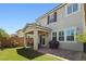 Backyard with a covered patio, pavers, a lawn, and a well-maintained exterior of the home at 2932 Tranquil Brook Ave, Henderson, NV 89044