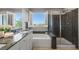 Elegant bathroom featuring a soaking tub, glass-enclosed shower, and granite countertops at 2932 Tranquil Brook Ave, Henderson, NV 89044