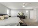 Spacious bedroom featuring plush carpeting, a modern ceiling fan, and neutral decor for a relaxing ambiance at 2932 Tranquil Brook Ave, Henderson, NV 89044
