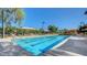 A refreshing community pool features lounge chairs, umbrellas and crystal clear water for residents to enjoy at 2932 Tranquil Brook Ave, Henderson, NV 89044