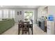 Open dining room with sliding glass doors and wood table at 2932 Tranquil Brook Ave, Henderson, NV 89044