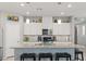 Well-lit kitchen featuring granite countertops, stainless steel appliances, and a kitchen island with seating at 2932 Tranquil Brook Ave, Henderson, NV 89044