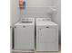 Compact laundry room with a side-by-side washer and dryer at 2932 Tranquil Brook Ave, Henderson, NV 89044