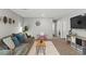 Cozy upstairs living area with a sofa, TV, and colorful decor at 2932 Tranquil Brook Ave, Henderson, NV 89044