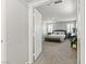 Spacious main bedroom with carpet, shutters, ceiling fan, and ensuite bathroom entrance at 2932 Tranquil Brook Ave, Henderson, NV 89044