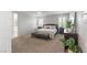 Spacious main bedroom with neutral tones, plantation shutters, and a glimpse of the ensuite bathroom at 2932 Tranquil Brook Ave, Henderson, NV 89044