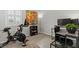 Functional office space with a desk and Peloton, creating an ideal work-from-home or exercise environment at 2932 Tranquil Brook Ave, Henderson, NV 89044