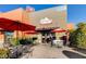 Inviting entrance to Romano's Italian Deli & Cafe, with outdoor seating under red umbrellas at 2932 Tranquil Brook Ave, Henderson, NV 89044