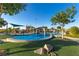 Community water park with play structures, water features and shaded seating areas on a sunny day at 2932 Tranquil Brook Ave, Henderson, NV 89044
