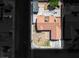An aerial view of the home showcasing its layout, roof, driveway, and backyard at 3016 Light Wind Ct, Las Vegas, NV 89108