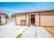 Open-door view of backyard shed offering storage and features a paved path and lush greenery at 3016 Light Wind Ct, Las Vegas, NV 89108