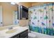 Bright bathroom featuring tub/shower combo with charming, aquatic-themed shower curtain at 3016 Light Wind Ct, Las Vegas, NV 89108