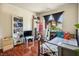 Bright bedroom with playful décor, hardwood floors and a black metal bed frame at 3016 Light Wind Ct, Las Vegas, NV 89108