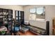 Functional bedroom featuring a built-in shelving and hardwood floors at 3016 Light Wind Ct, Las Vegas, NV 89108