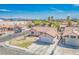Single-story home featuring a two-car garage and well-maintained landscaping with mountain views in the background at 3016 Light Wind Ct, Las Vegas, NV 89108