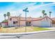 Charming single-story home with well-maintained lawn, desert landscaping, and two-car garage at 3016 Light Wind Ct, Las Vegas, NV 89108