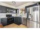 Efficient kitchen featuring stainless steel appliances and sleek dark cabinetry at 3016 Light Wind Ct, Las Vegas, NV 89108