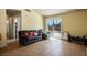 Cozy living room with neutral walls and a sliding door leading to the backyard at 3016 Light Wind Ct, Las Vegas, NV 89108