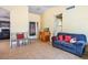 Comfortable living room with tile flooring and a sliding glass door that offers access to the back yard at 3016 Light Wind Ct, Las Vegas, NV 89108