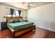 Spacious main bedroom featuring a ceiling fan and wood flooring at 3016 Light Wind Ct, Las Vegas, NV 89108