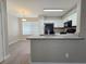 Well-lit kitchen showcasing modern cabinetry, sleek appliances, and a breakfast bar perfect for casual dining and entertaining at 3038 Tarpon Dr # 203, Las Vegas, NV 89120