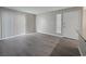This spacious, light-filled living area offers modern flooring, neutral colors, and a sliding glass door for indoor-outdoor living at 3038 Tarpon Dr # 203, Las Vegas, NV 89120