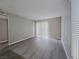 Inviting living room featuring wood-look floors, fresh neutral paint, and ample natural light from the window and sliding door at 3038 Tarpon Dr # 203, Las Vegas, NV 89120
