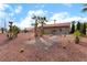 Backyard oasis with palm trees, patio, and desert-friendly xeriscaping creating a relaxing outdoor retreat at 3157 Faiss Dr, Las Vegas, NV 89134