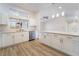 Bright kitchen featuring white cabinets and stainless steel appliances at 3157 Faiss Dr, Las Vegas, NV 89134