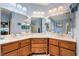 Well-lit bathroom featuring a double vanity, tile flooring, and ample storage space for all your needs at 3221 Palmdesert Way, Las Vegas, NV 89120