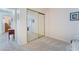 Bedroom featuring mirrored closet doors, plush carpet, and a doorway leading to another room at 3221 Palmdesert Way, Las Vegas, NV 89120