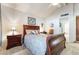 Serene bedroom featuring soft carpeting, a comfortable bed, and a well-lit bedside table at 3221 Palmdesert Way, Las Vegas, NV 89120