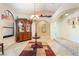 Dining area featuring elegant lighting, tile flooring, and an arched doorway into the adjacent room at 3221 Palmdesert Way, Las Vegas, NV 89120