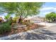 Beautiful home with mature landscaping, a large shade tree, and a well-maintained front yard at 3221 Palmdesert Way, Las Vegas, NV 89120