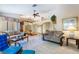 Spacious open living room featuring plush carpeting, comfortable seating, and abundant natural light at 3221 Palmdesert Way, Las Vegas, NV 89120