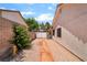 Side yard featuring desert landscaping and access to the backyard at 3221 Palmdesert Way, Las Vegas, NV 89120