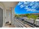 Balcony with view of a parking area, neighboring buildings, and sparse trees on a clear, sunny day at 3318 N Decatur Blvd # 2073, Las Vegas, NV 89130