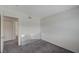 Carpeted bedroom with connecting door and corner mirror at 3318 N Decatur Blvd # 2073, Las Vegas, NV 89130