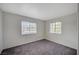 Cozy bedroom with plush gray carpeting and dual windows providing natural light at 3318 N Decatur Blvd # 2073, Las Vegas, NV 89130