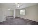 Bedroom area with a ceiling fan, sliding mirrored closet, and a window that lets in natural light at 3318 N Decatur Blvd # 2073, Las Vegas, NV 89130