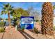 The Coral Palms Condominiums community sign is well-maintained and surrounded by mature landscaping at 3318 N Decatur Blvd # 2073, Las Vegas, NV 89130