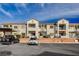 Exterior apartment view of unit, parking lot and landscaping, including nearby covered parking at 3318 N Decatur Blvd # 2073, Las Vegas, NV 89130