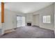 Bright living room featuring a fireplace, sliding glass doors, and neutral carpeting for a comfortable feel at 3318 N Decatur Blvd # 2073, Las Vegas, NV 89130