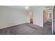Primary bedroom with neutral walls and carpets including views of an ensuite bathroom and a walk-in closet at 3318 N Decatur Blvd # 2073, Las Vegas, NV 89130
