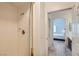 A bathroom featuring a tiled shower with glass doors and modern fixtures at 3924 Quiet Pine St # 201, Las Vegas, NV 89108