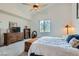 Spacious bedroom featuring carpet, a window, a fan, a dresser, and decorative items at 3924 Quiet Pine St # 201, Las Vegas, NV 89108