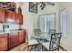 Bright dining area featuring a glass table, seating for four, and stylish decor under a ceiling fan at 3924 Quiet Pine St # 201, Las Vegas, NV 89108